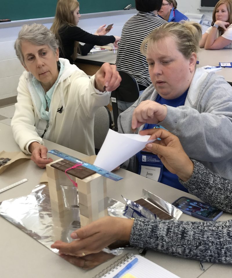 Teachers breaking chocolate