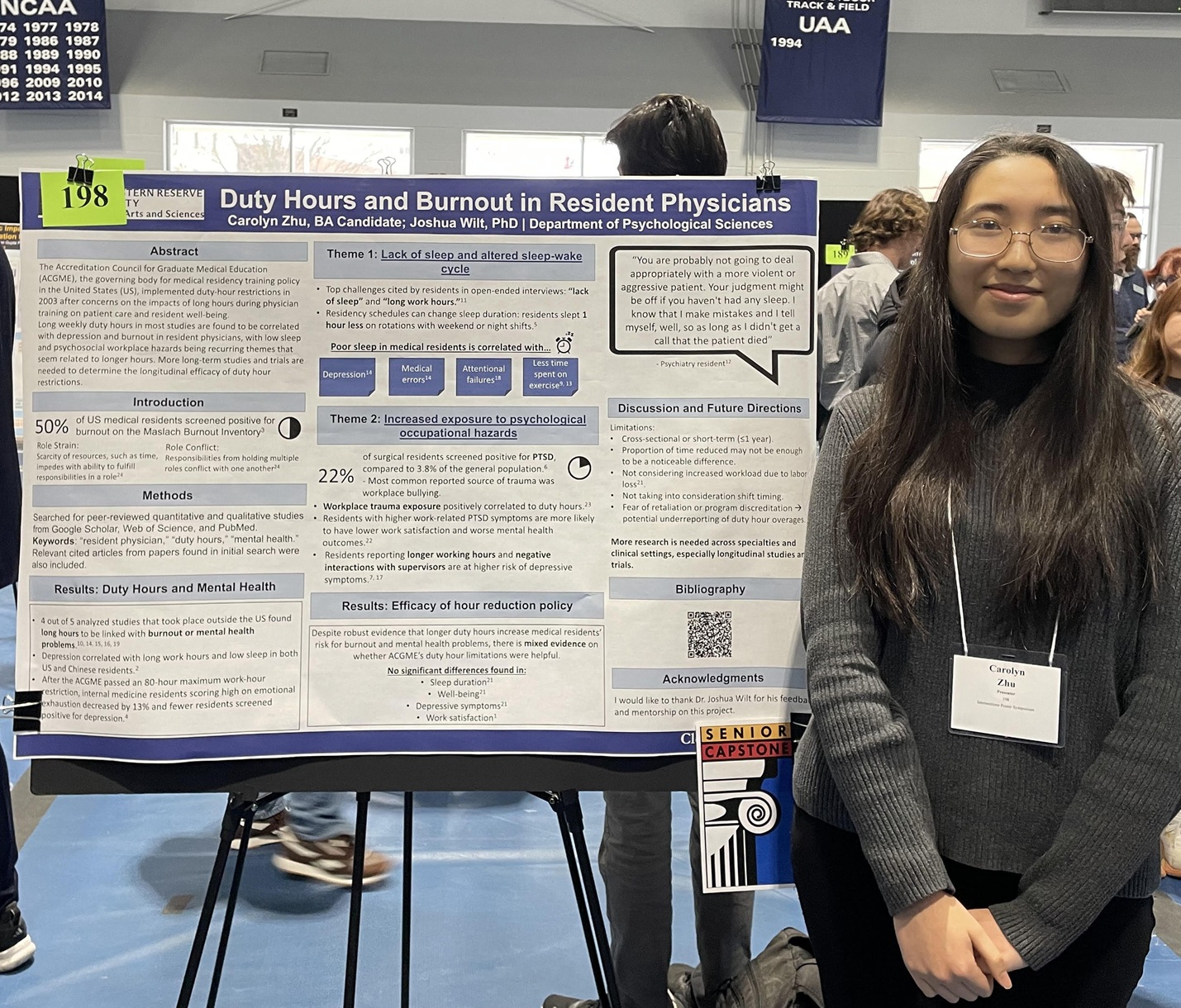 Person presenting research poster