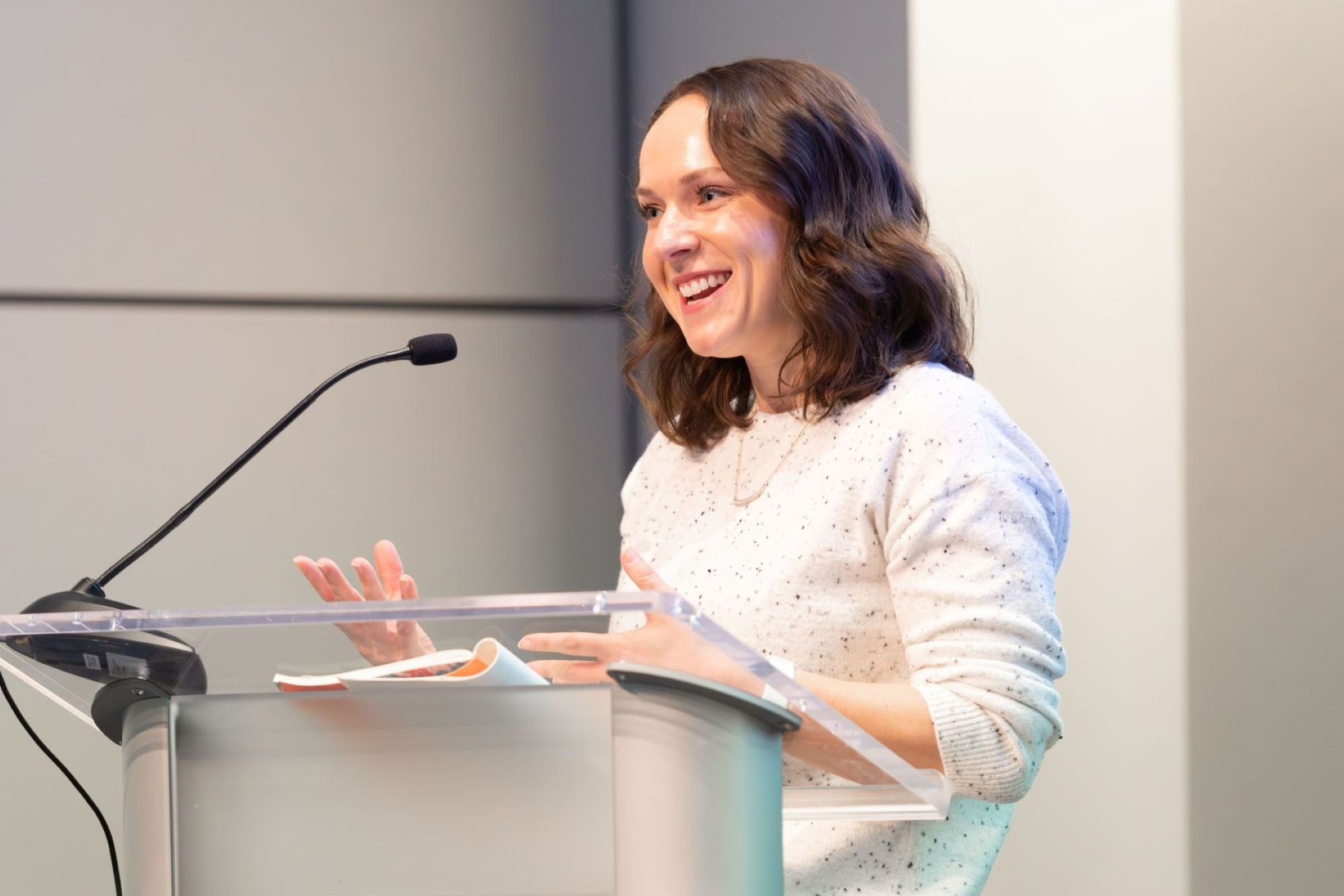 woman presenting at podium